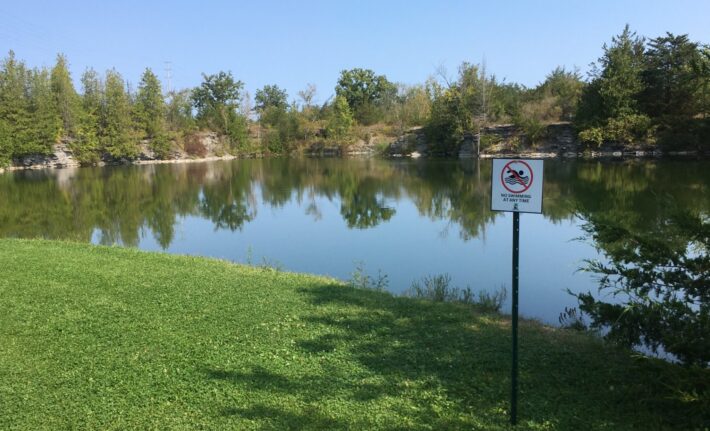 No swimming sign posted by the edge the the Seymour COnservation Area quarry